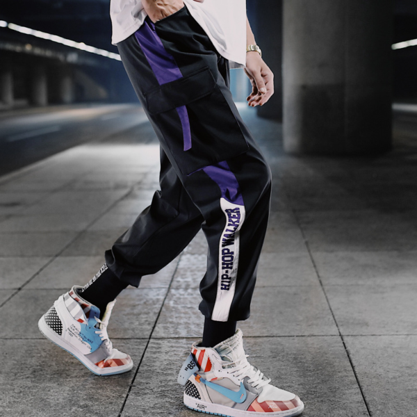 Cyberpunk streetwear joggers pant cool pose purple stripe